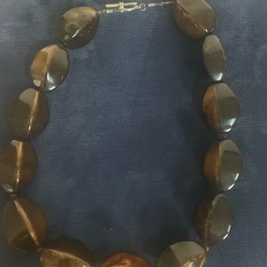 Beautiful brown beads with metal, silver color toggle clasp necklace.
